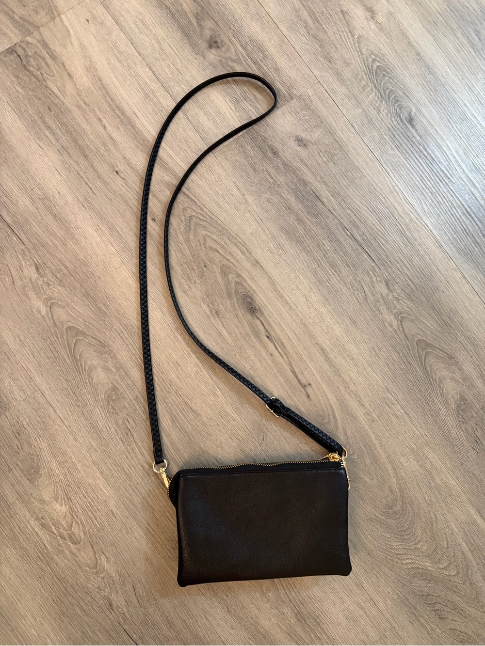 Minimal Black Leather Crossbody Bag with Gold Hardware